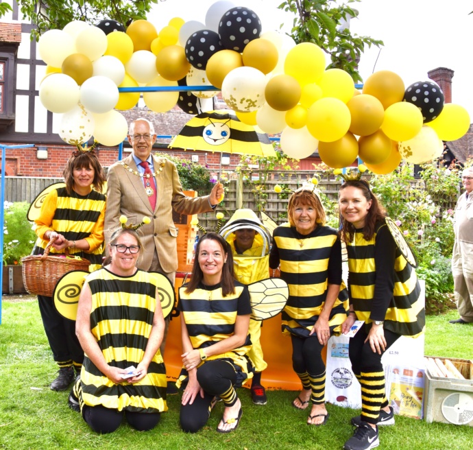 A group of people dressed in yellow and black bee fancy dress